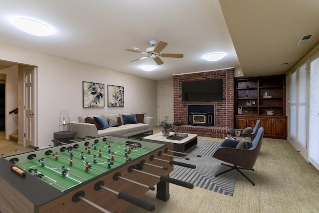 playroom featuring ceiling fan, visible vents, and light colored carpet