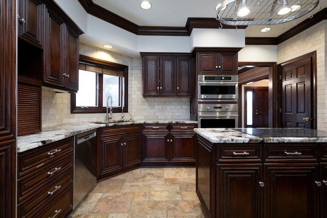 kitchen with light stone counters, ornamental molding, stone finish flooring, stainless steel appliances, and a sink