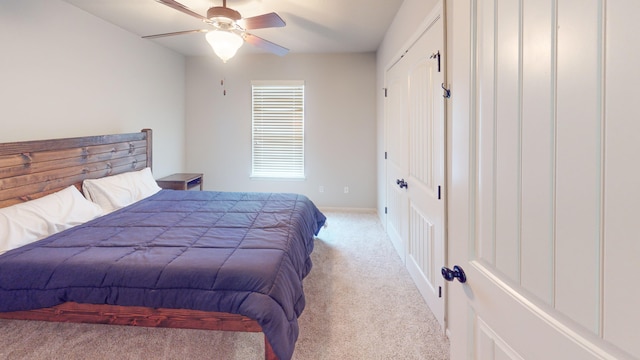 carpeted bedroom featuring ceiling fan