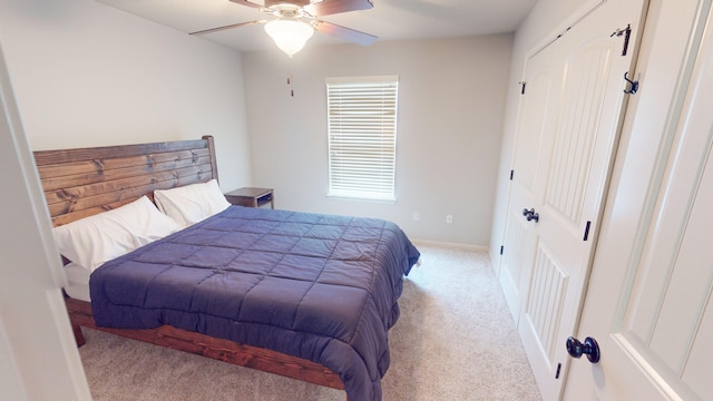 bedroom with ceiling fan and light colored carpet