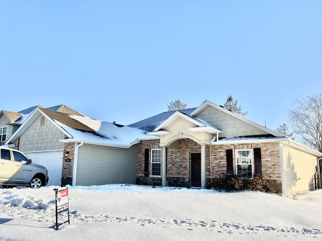 view of front of property featuring a garage