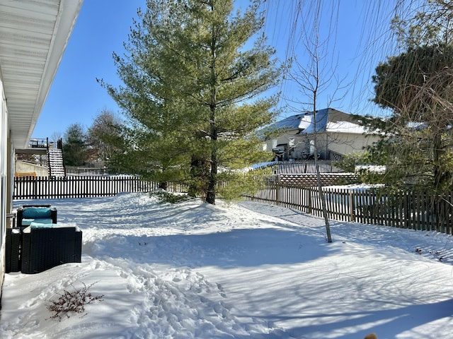 view of yard covered in snow