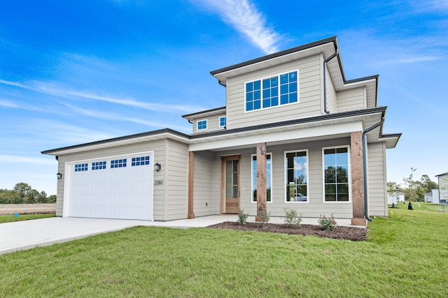 view of front of home featuring a front yard, a porch, concrete driveway, and an attached garage