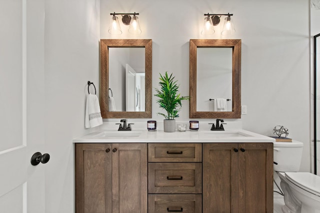 bathroom featuring vanity and toilet