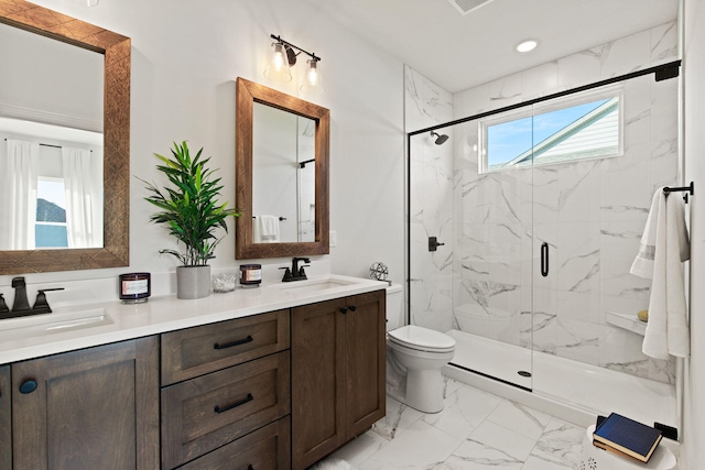 bathroom featuring walk in shower, vanity, plenty of natural light, and toilet