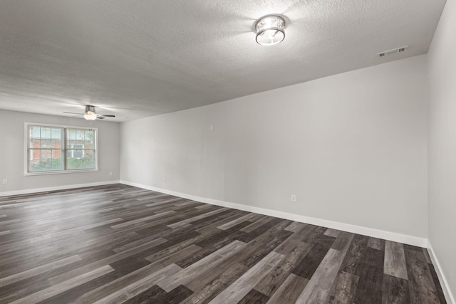 unfurnished room with ceiling fan, dark hardwood / wood-style floors, and a textured ceiling