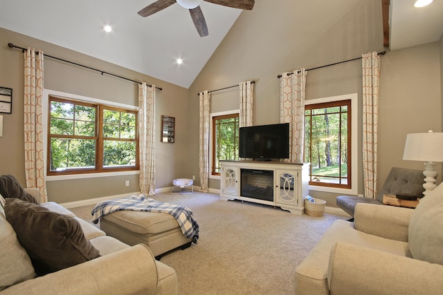 living room featuring carpet floors, ceiling fan, and high vaulted ceiling