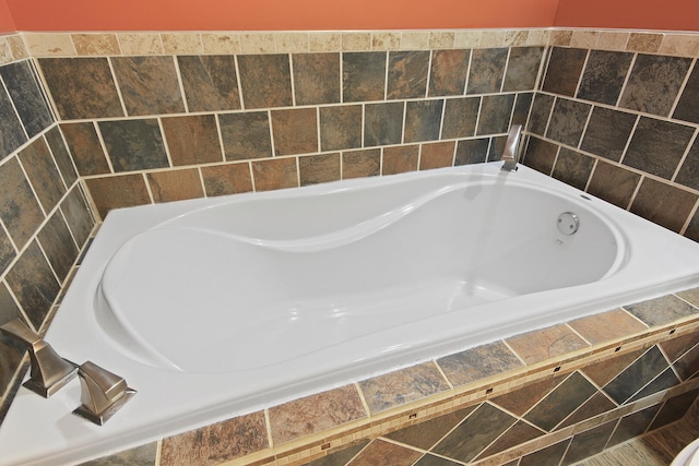 full bath with tiled tub