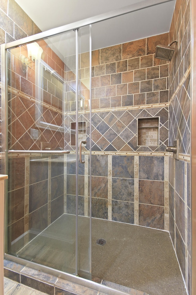 bathroom featuring a stall shower