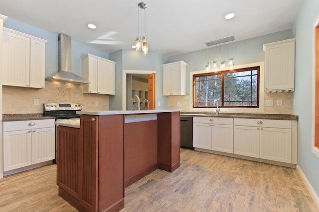 kitchen featuring black dishwasher, pendant lighting, a kitchen island, stainless steel range with electric stovetop, and wall chimney exhaust hood