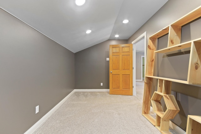 bonus room with baseboards, vaulted ceiling, recessed lighting, and light colored carpet