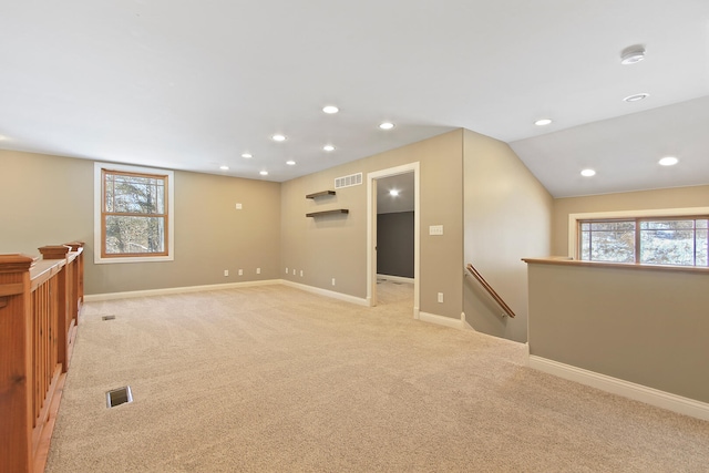 unfurnished room featuring light carpet, recessed lighting, visible vents, and baseboards