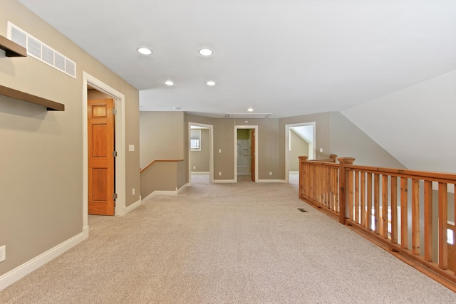 bonus room featuring light carpet, baseboards, visible vents, and recessed lighting