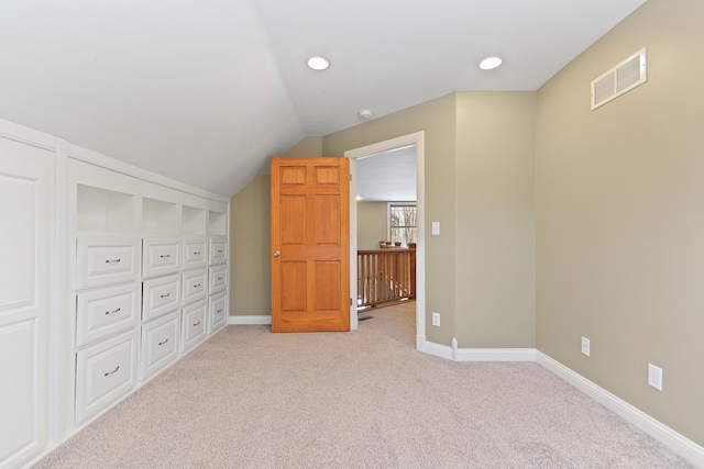 bonus room featuring recessed lighting, light colored carpet, visible vents, vaulted ceiling, and baseboards