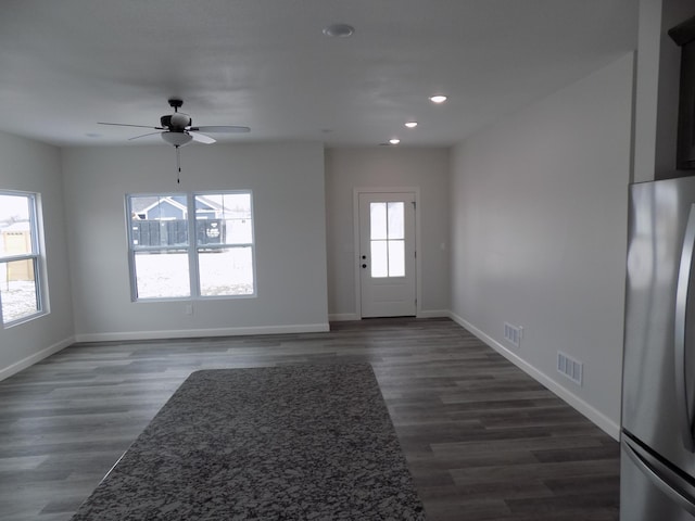 interior space with ceiling fan, dark hardwood / wood-style flooring, and plenty of natural light