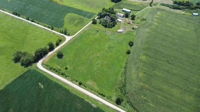 birds eye view of property with a rural view