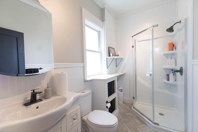 bathroom featuring vanity, crown molding, an enclosed shower, parquet flooring, and toilet