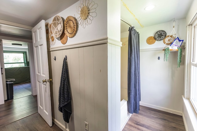 hallway featuring dark hardwood / wood-style flooring