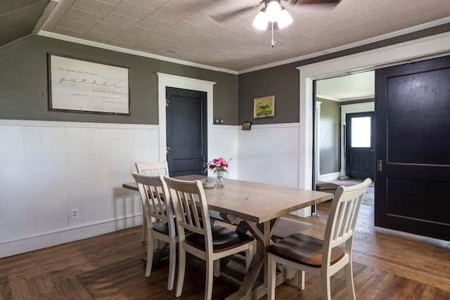 dining area featuring ceiling fan and crown molding