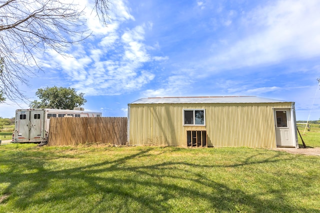 view of outdoor structure with a lawn