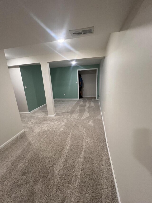 basement featuring carpet flooring