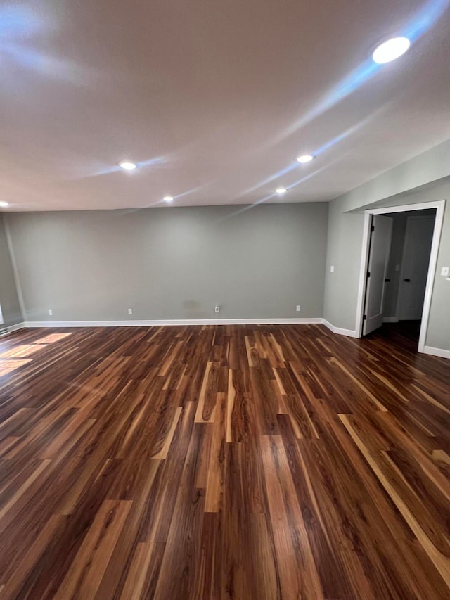 basement with dark wood-type flooring