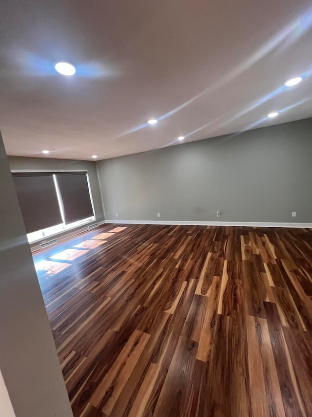 unfurnished room with hardwood / wood-style flooring