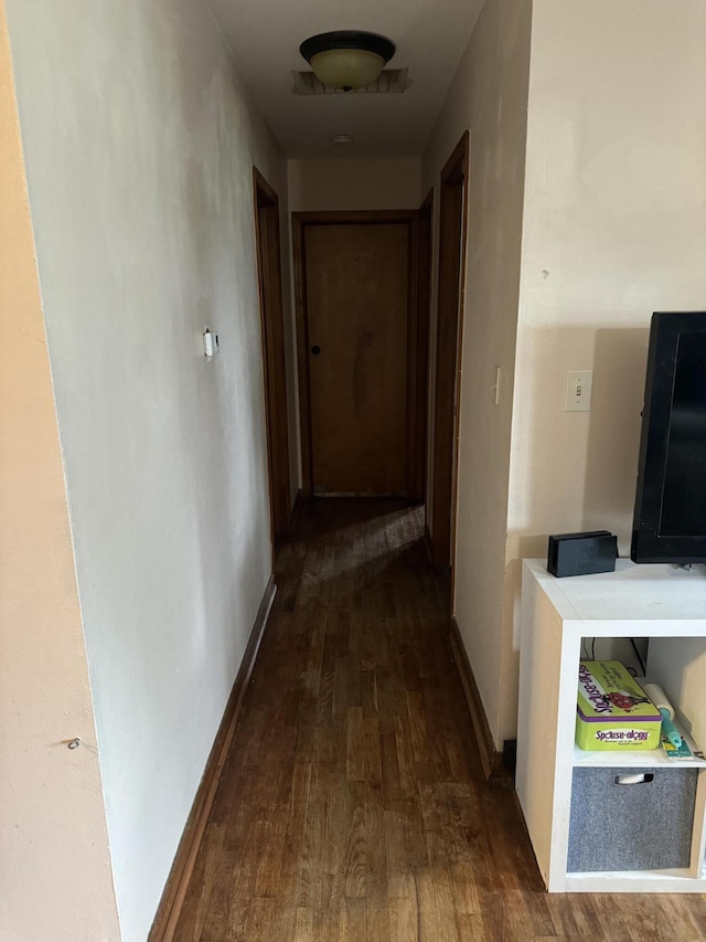 corridor featuring wood-type flooring