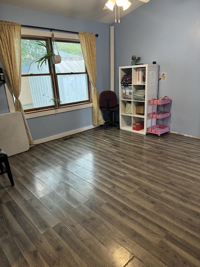 sitting room with ceiling fan and dark hardwood / wood-style floors