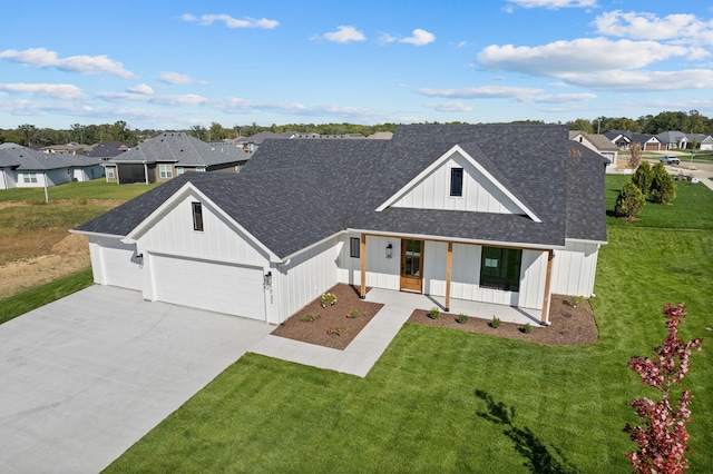 modern inspired farmhouse featuring a front lawn, a shingled roof, a garage, and concrete driveway