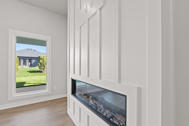 room details featuring baseboards and wood finished floors