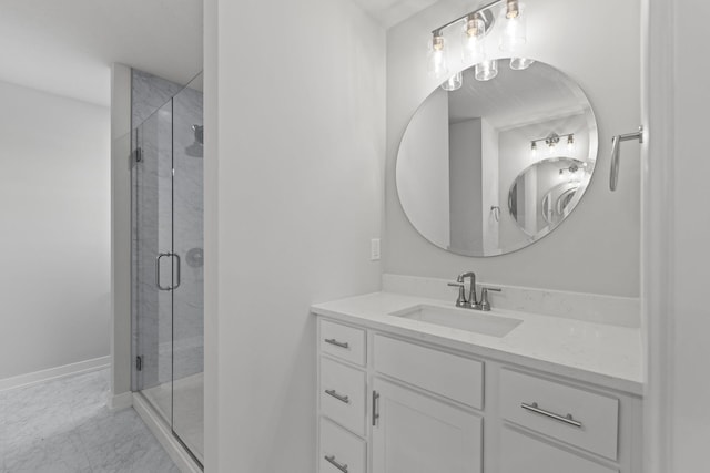 full bathroom featuring marble finish floor, vanity, a stall shower, and baseboards