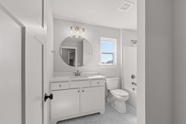 bathroom featuring toilet, vanity, marble finish floor, visible vents, and shower / bath combination