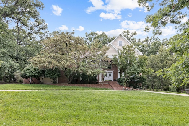 obstructed view of property featuring a front lawn