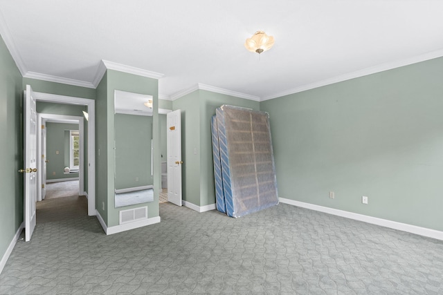 unfurnished bedroom featuring visible vents, crown molding, light carpet, and baseboards