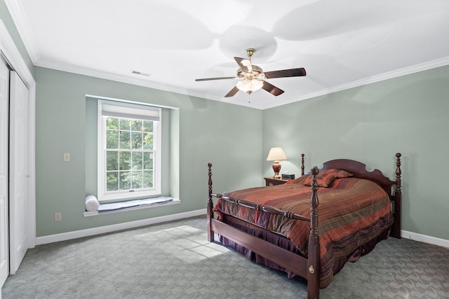 bedroom featuring ornamental molding, light carpet, visible vents, and baseboards