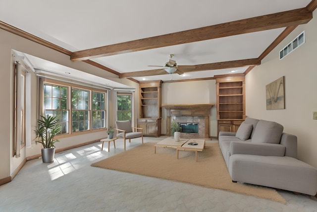 living area with baseboards, visible vents, a ceiling fan, a premium fireplace, and beamed ceiling