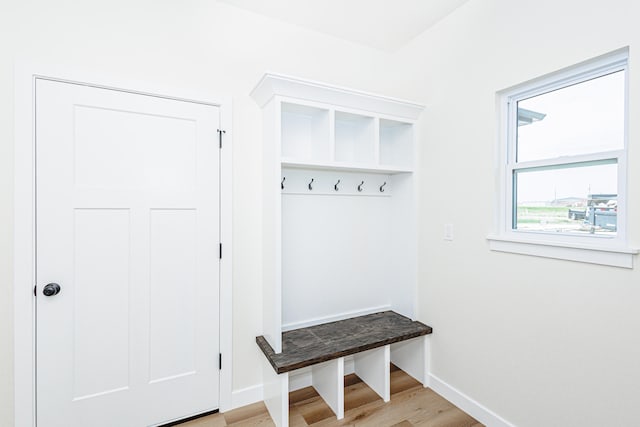 mudroom with light hardwood / wood-style flooring