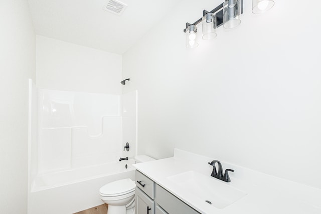 full bathroom featuring toilet, tub / shower combination, vanity, and hardwood / wood-style floors