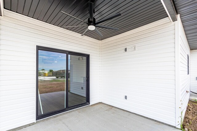 exterior space with ceiling fan