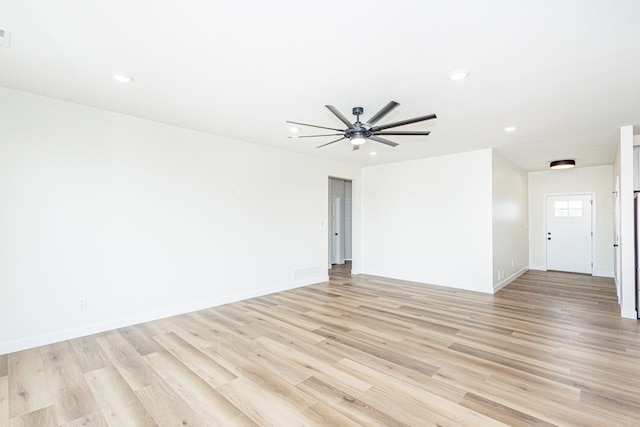 empty room with light hardwood / wood-style floors and ceiling fan