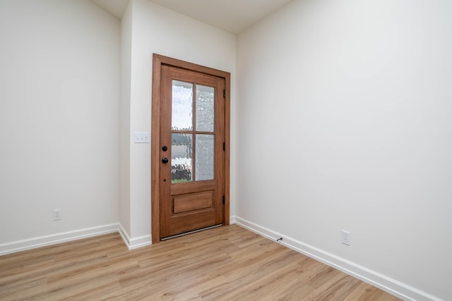 foyer entrance with light hardwood / wood-style floors