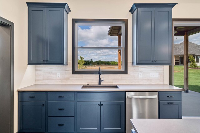 kitchen with dishwasher, plenty of natural light, and sink