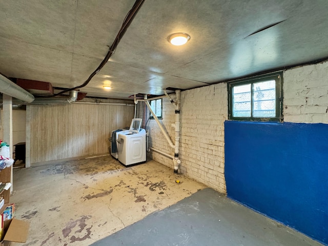 basement with washer and clothes dryer