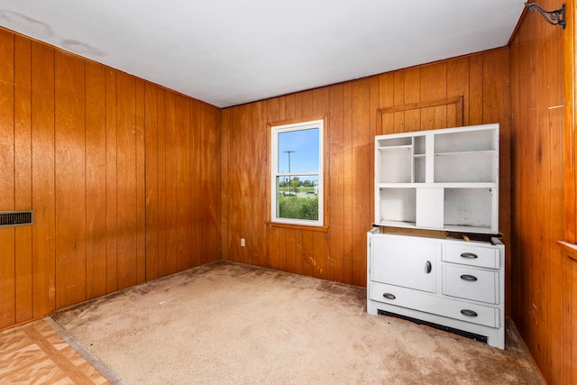 unfurnished bedroom with wood walls