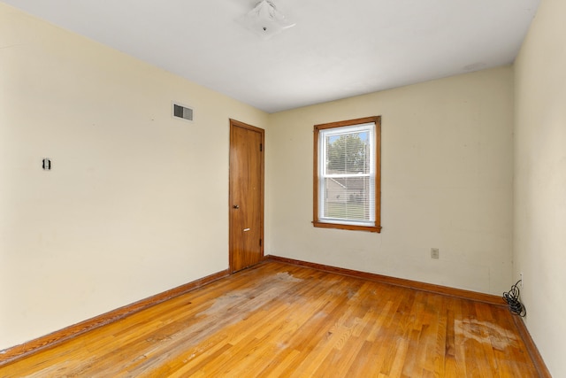 empty room featuring hardwood / wood-style flooring