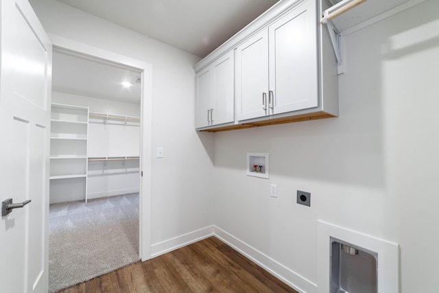 clothes washing area featuring cabinets, hookup for an electric dryer, washer hookup, and dark hardwood / wood-style floors