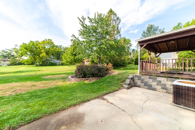 view of yard with cooling unit, a gazebo, and a patio area