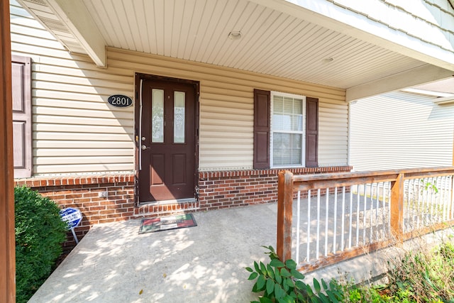 entrance to property featuring a porch