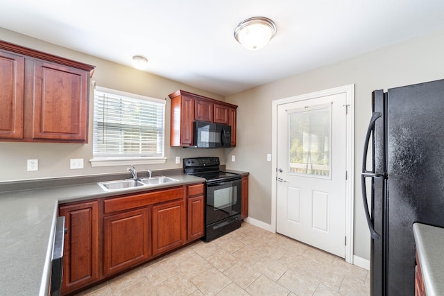 kitchen with black appliances and sink